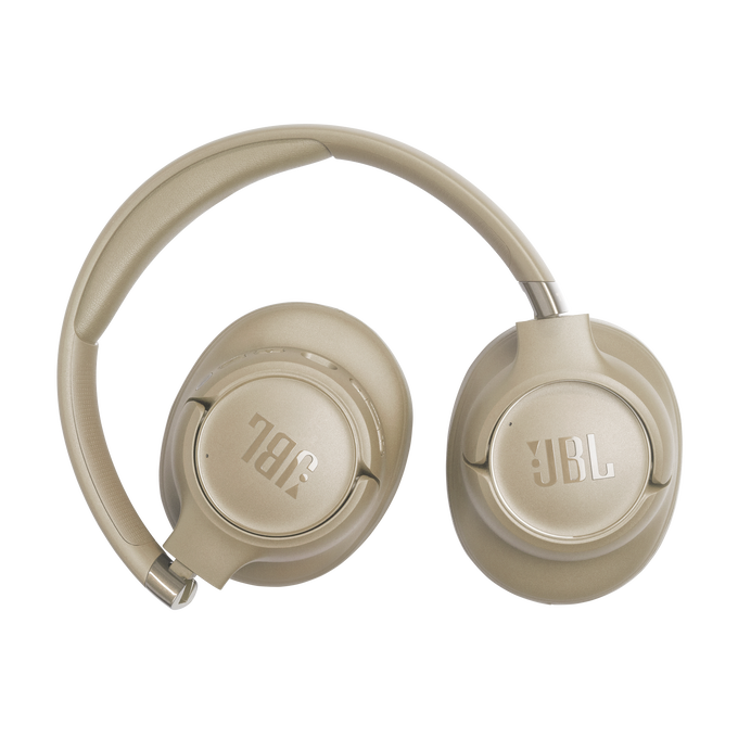 Beige JBL headphones on a white background